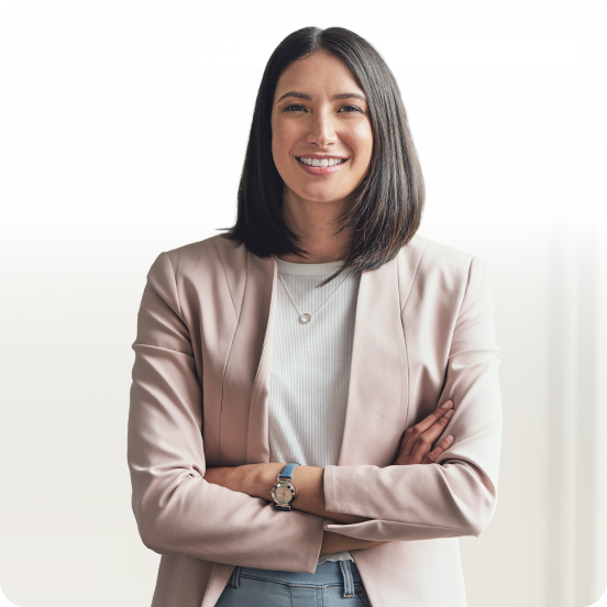 Smiling woman in a blazer with her arms crossed